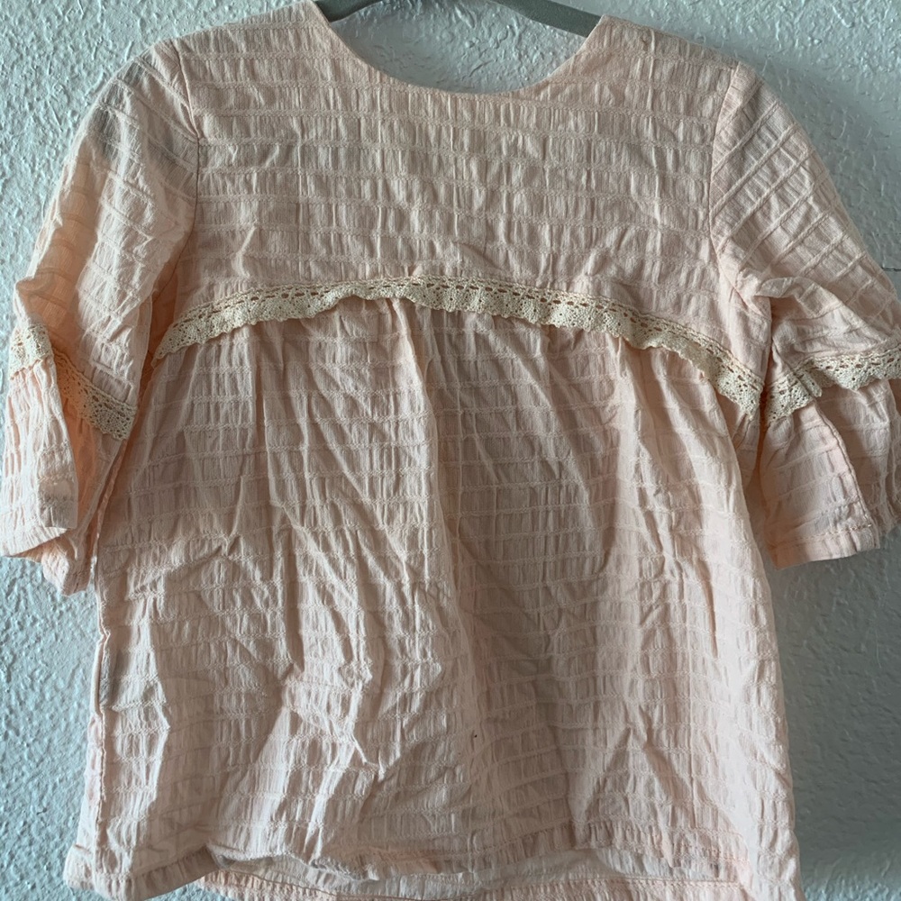 Light pink long bell sleeve blouse